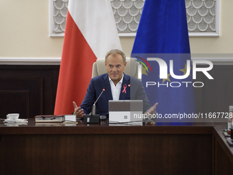 Poland's Prime Minister Donald Tusk gestures as he takes part in the weekly Ministerial meeting in Warsaw, Poland, on October 15, 2024. (