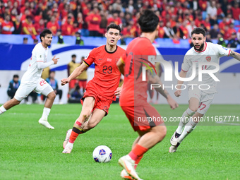 In Qingdao, China, on October 15, 2024, a photo shows Chinese soccer players during their match against Indonesia at home in the 4th round o...