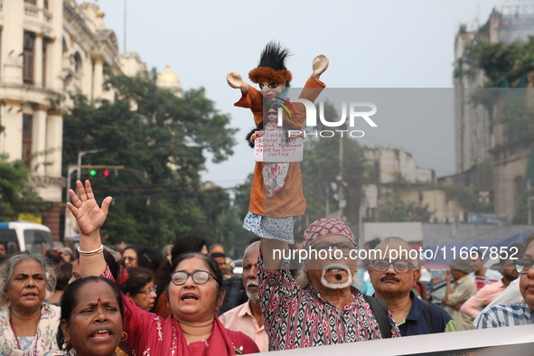 Doctors and citizens shout slogans during a protest carnival, the ''Droho carnival,'' demanding that India's West Bengal state government pr...