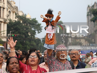 Doctors and citizens shout slogans during a protest carnival, the ''Droho carnival,'' demanding that India's West Bengal state government pr...