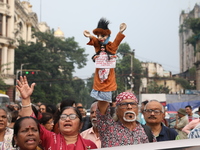 Doctors and citizens shout slogans during a protest carnival, the ''Droho carnival,'' demanding that India's West Bengal state government pr...