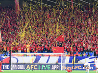 Fans cheer for China during their football match against Indonesia in the fourth round of the World Cup Qualifiers in Qingdao, China, on Oct...