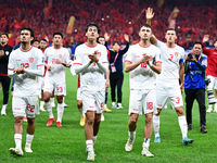 Indonesia players greet during the Chinese football team's match against Indonesia in the 4th round of the World Qualifiers Asian Zone in Qi...