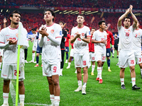 Indonesia players greet during the Chinese football team's match against Indonesia in the 4th round of the World Qualifiers Asian Zone in Qi...