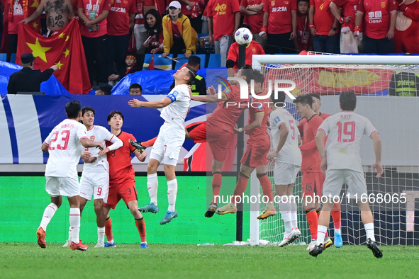 The photo shows Chinese soccer players during their match against Indonesia at home in the 4th round of World Qualifiers Asian Zone in Qingd...