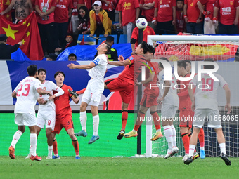 The photo shows Chinese soccer players during their match against Indonesia at home in the 4th round of World Qualifiers Asian Zone in Qingd...