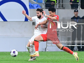 The photo shows Chinese soccer players during their match against Indonesia at home in the 4th round of World Qualifiers Asian Zone in Qingd...