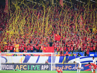 Fans cheer for China during their football match against Indonesia in the fourth round of the World Cup Qualifiers in Qingdao, China, on Oct...