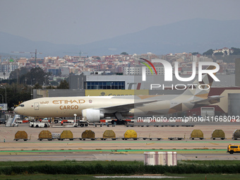 A Boeing 777-FFX of Etihad Cargo parks in the parking area of Barcelona airport to unload, in Barcelona, Spain, on October 15, 2024. (