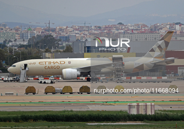 A Boeing 777-FFX of Etihad Cargo is parked in the parking area of Barcelona airport unloading, in Barcelona, Spain, on October 15, 2024. 