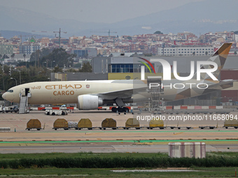 A Boeing 777-FFX of Etihad Cargo is parked in the parking area of Barcelona airport unloading, in Barcelona, Spain, on October 15, 2024. (