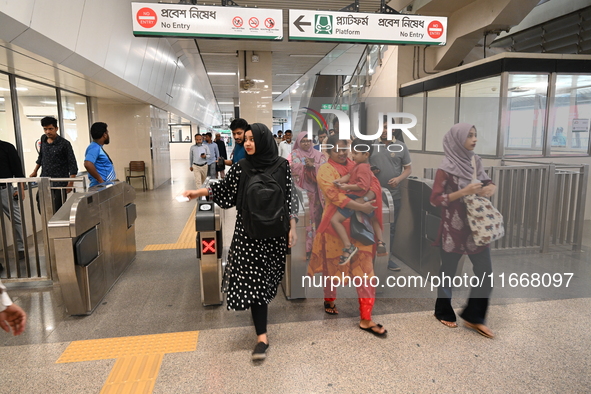 Passengers are able to board the metro rail from the Mirpur-10 station in Dhaka, Bangladesh, on October 15, 2024. The Dhaka Mirpur-10 metro...