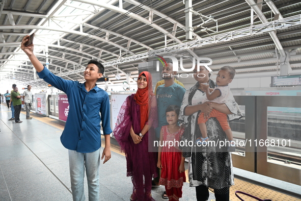 Passengers are able to board the metro rail from the Mirpur-10 station in Dhaka, Bangladesh, on October 15, 2024. The Dhaka Mirpur-10 metro...