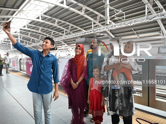 Passengers are able to board the metro rail from the Mirpur-10 station in Dhaka, Bangladesh, on October 15, 2024. The Dhaka Mirpur-10 metro...