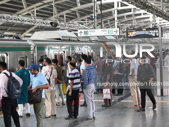 Passengers are able to board the metro rail from the Mirpur-10 station in Dhaka, Bangladesh, on October 15, 2024. The Dhaka Mirpur-10 metro...