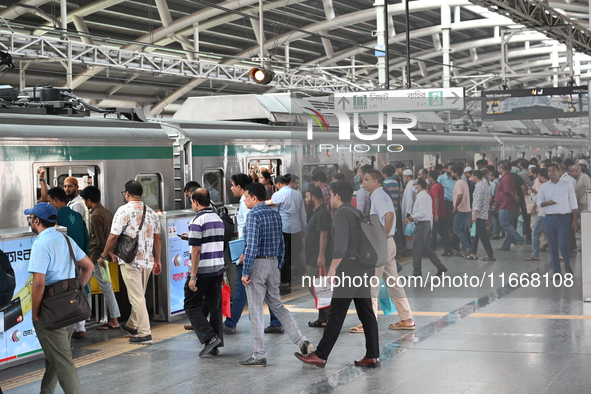 Passengers are able to board the metro rail from the Mirpur-10 station in Dhaka, Bangladesh, on October 15, 2024. The Dhaka Mirpur-10 metro...