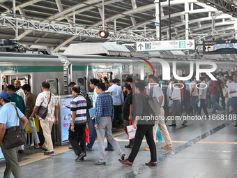 Passengers are able to board the metro rail from the Mirpur-10 station in Dhaka, Bangladesh, on October 15, 2024. The Dhaka Mirpur-10 metro...