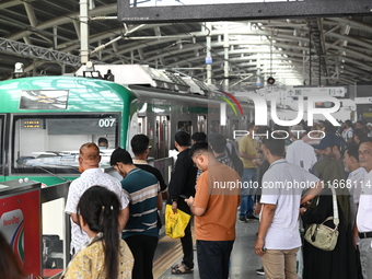 Passengers are able to board the metro rail from the Mirpur-10 station in Dhaka, Bangladesh, on October 15, 2024. The Dhaka Mirpur-10 metro...