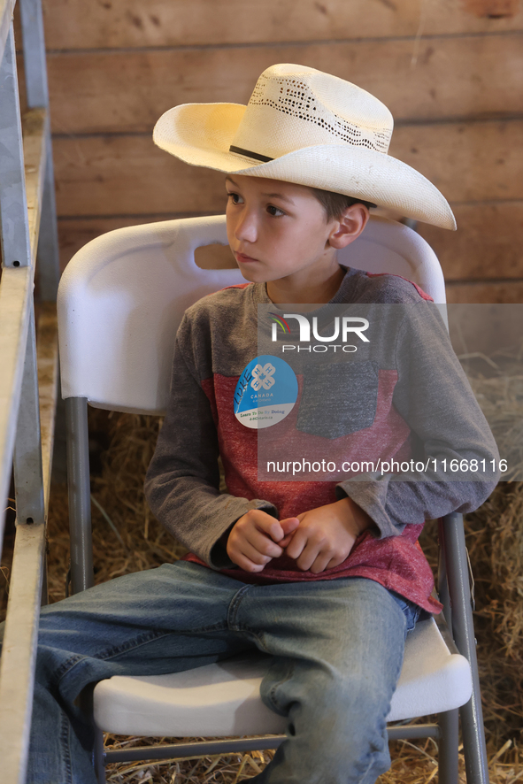 A young cowboy participates in the 180th annual Markham Fall Fair in Markham, Ontario, Canada, on October 5, 2024. 