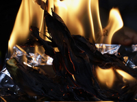 A chef burns corn husks to turn them into ashes (totomoxtle) in Mexico City, Mexico, on the eve of the Day of the Dead, to make Pan de Muert...