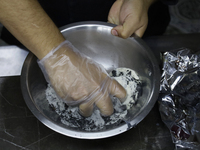 A chef mixes totomoxtle (corn husk ash) and sugar in Mexico City, Mexico, on the eve of Day of the Dead, to make Pan de Muerto. According to...