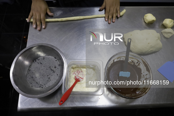 Preparation of Pan de Muerto in Mexico City, Mexico, on the eve of the Day of the Dead. According to historical documents and accounts, in a...