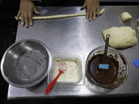 Preparation of Pan de Muerto in Mexico City, Mexico, on the eve of the Day of the Dead. According to historical documents and accounts, in a...