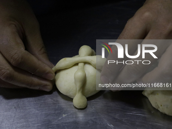 Preparation of Pan de Muerto in Mexico City, Mexico, on the eve of the Day of the Dead. According to historical documents and accounts, in a...