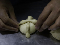 Preparation of Pan de Muerto in Mexico City, Mexico, on the eve of the Day of the Dead. According to historical documents and accounts, in a...