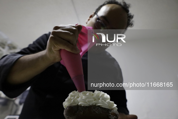 Preparation of Pan de Muerto in Mexico City, Mexico, on the eve of the Day of the Dead. According to historical documents and accounts, in a...