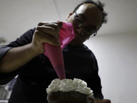 Preparation of Pan de Muerto in Mexico City, Mexico, on the eve of the Day of the Dead. According to historical documents and accounts, in a...