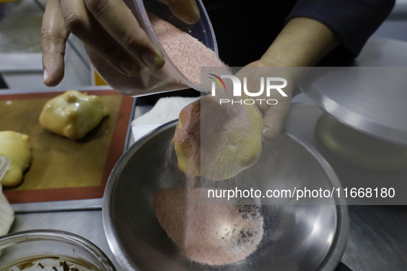 Preparation of Pan de Muerto in Mexico City, Mexico, on the eve of the Day of the Dead. According to historical documents and accounts, in a...