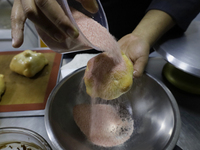 Preparation of Pan de Muerto in Mexico City, Mexico, on the eve of the Day of the Dead. According to historical documents and accounts, in a...