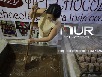 Chocolate mix is used to make and sell chocolate skulls in Mexico City, Mexico, on the eve of Day of the Dead. Sugar skulls are made from al...