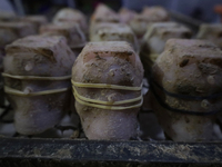 Molds for making chocolate skulls are for sale in Mexico City, Mexico, on the eve of the Day of the Dead. Sugar skulls are made from alfeniq...