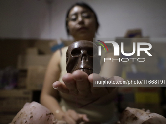 View of chocolate skulls for sale in Mexico City, Mexico, on the eve of Day of the Dead. Sugar skulls are made from alfenique, which later c...