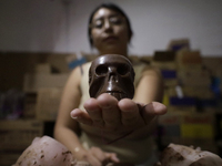 View of chocolate skulls for sale in Mexico City, Mexico, on the eve of Day of the Dead. Sugar skulls are made from alfenique, which later c...