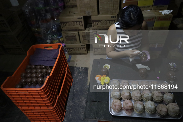 Decorated chocolate skulls are for sale in Mexico City, Mexico, on the eve of the Day of the Dead. Sugar skulls are made from alfenique, whi...