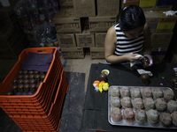 Decorated chocolate skulls are for sale in Mexico City, Mexico, on the eve of the Day of the Dead. Sugar skulls are made from alfenique, whi...