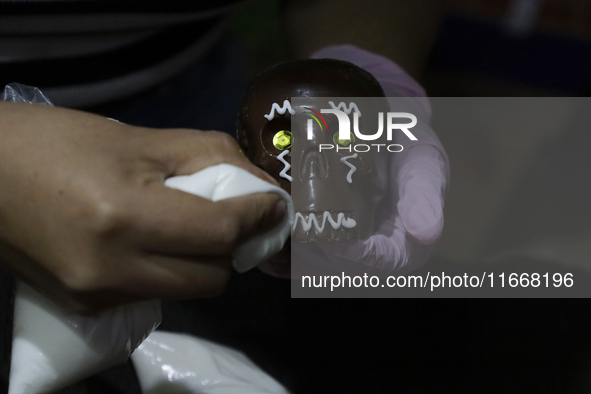 Decorated chocolate skulls are for sale in Mexico City, Mexico, on the eve of the Day of the Dead. Sugar skulls are made from alfenique, whi...