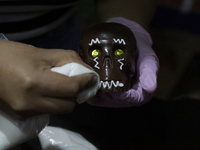 Decorated chocolate skulls are for sale in Mexico City, Mexico, on the eve of the Day of the Dead. Sugar skulls are made from alfenique, whi...