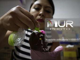 Decorated chocolate skulls are for sale in Mexico City, Mexico, on the eve of the Day of the Dead. Sugar skulls are made from alfenique, whi...