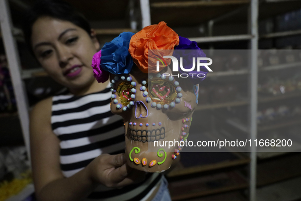 Decorated chocolate skulls are for sale in Mexico City, Mexico, on the eve of the Day of the Dead. Sugar skulls are made from alfenique, whi...