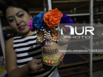 Decorated chocolate skulls are for sale in Mexico City, Mexico, on the eve of the Day of the Dead. Sugar skulls are made from alfenique, whi...