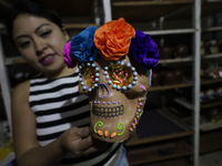 Decorated chocolate skulls are for sale in Mexico City, Mexico, on the eve of the Day of the Dead. Sugar skulls are made from alfenique, whi...