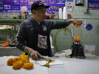 Pulque is prepared from Cempasuchil flower petals in Mexico City, Mexico, on the eve of the Day of the Dead. Pulque is an alcoholic beverage...