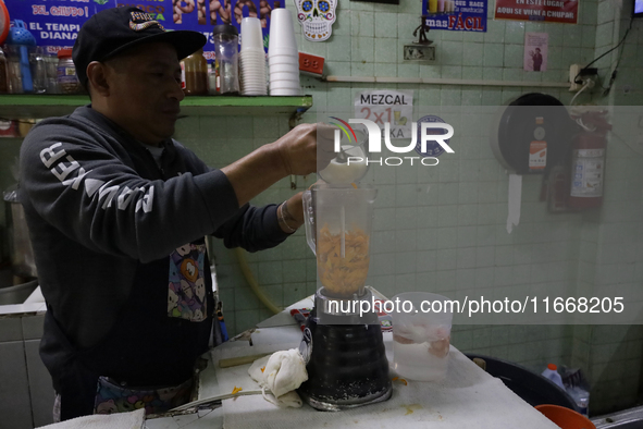 Pulque is prepared from Cempasuchil flower petals in Mexico City, Mexico, on the eve of the Day of the Dead. Pulque is an alcoholic beverage...