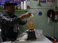 Pulque is prepared from Cempasuchil flower petals in Mexico City, Mexico, on the eve of the Day of the Dead. Pulque is an alcoholic beverage...