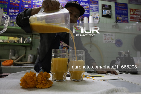 Pulque is prepared from Cempasuchil flower petals in Mexico City, Mexico, on the eve of the Day of the Dead. Pulque is an alcoholic beverage...