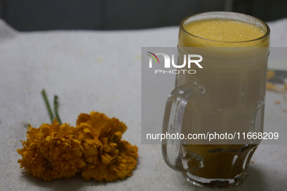 Pulque with Cempasuchil flower petals is viewed in Mexico City, Mexico, on the eve of the Day of the Dead. Pulque is an alcoholic beverage o...